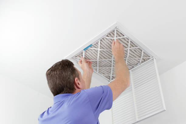 Man changing air filter