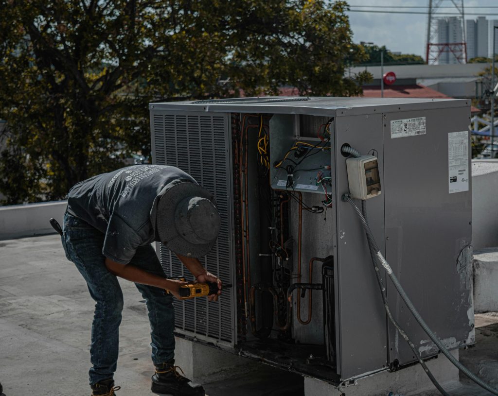 Hvac working on roof commercial unit